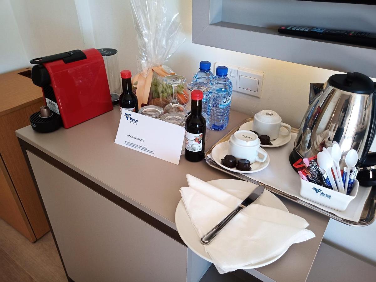 Venus Beach Hotel Paphos Esterno foto A Nespresso machine in a hotel room