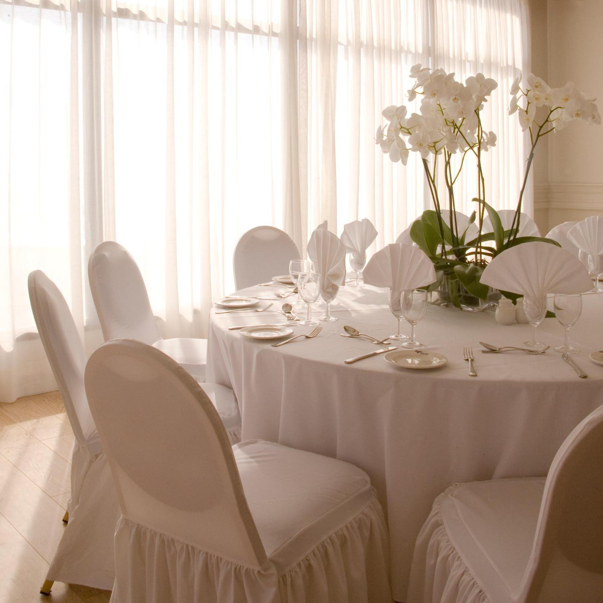 Venus Beach Hotel Paphos Esterno foto A table set for a formal dinner